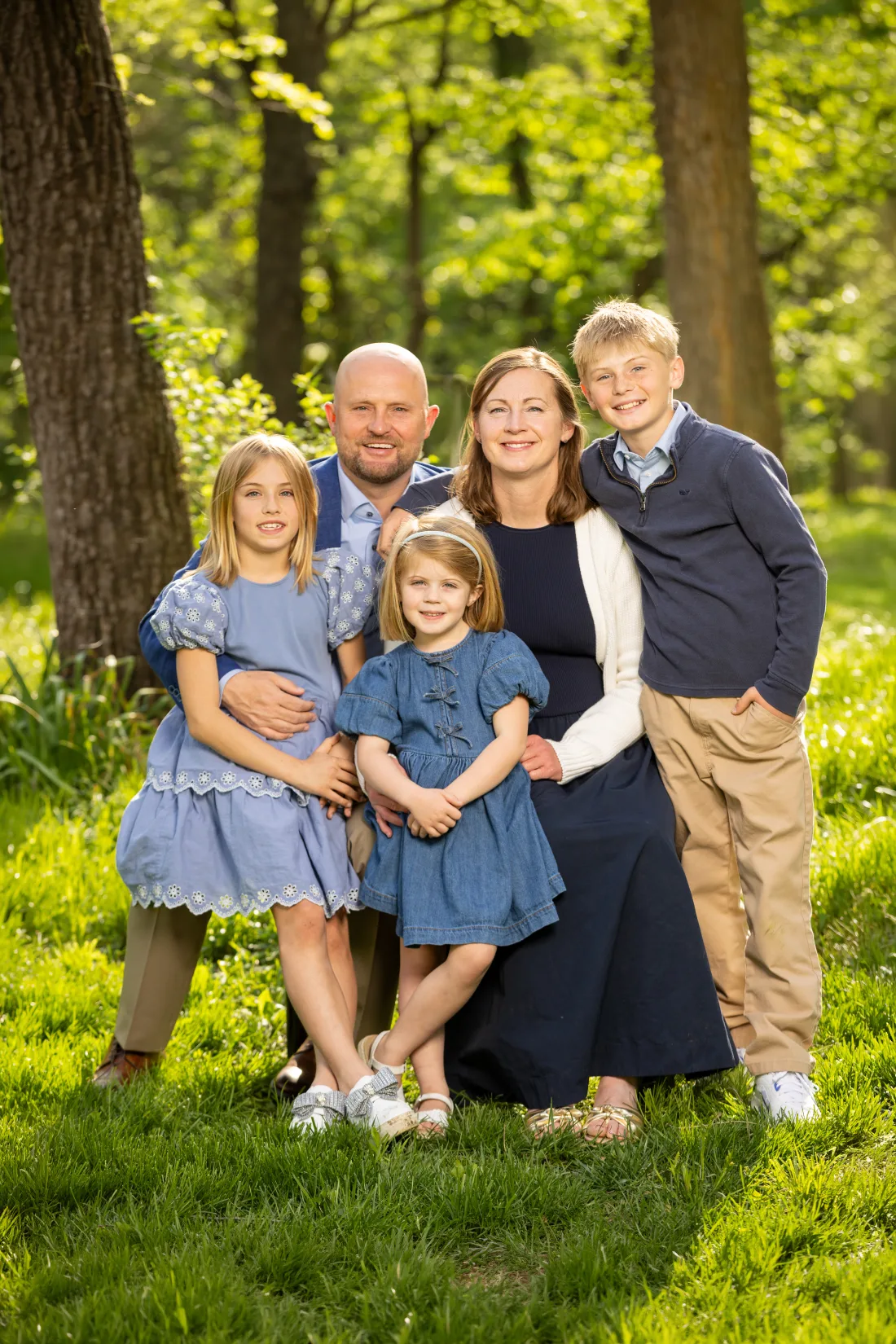 The Rogers family in sunlit woods.